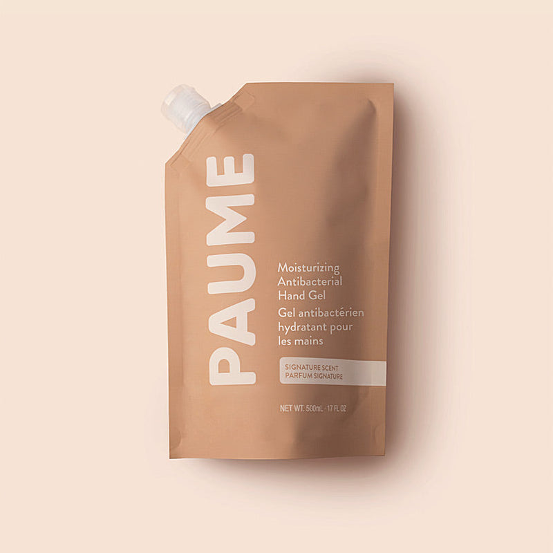 PAUME hand gel packaging on a beige background